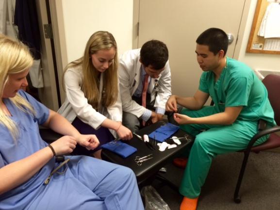 Residents teaching medical students.